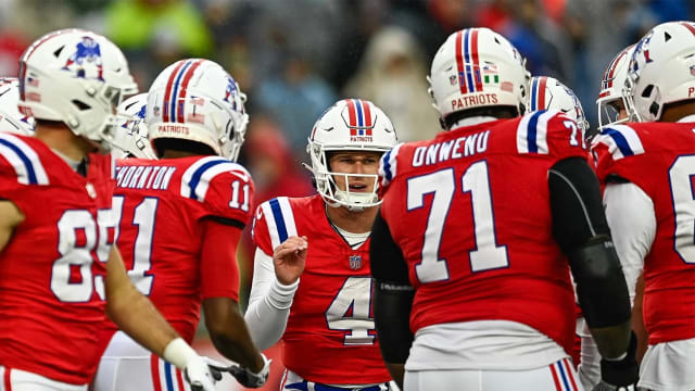 New England Patriots QB Bailey Zappe leads the huddle